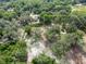 Aerial view of property highlighting its location amongst trees at 7813 Valrie Ln, Riverview, FL 33569
