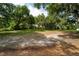 Wooded lot with a dirt path leading through it at 7813 Valrie Ln, Riverview, FL 33569