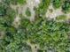 Aerial view of a vacant lot in a wooded area at 7813 Valrie Ln, Riverview, FL 33569