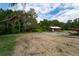 Cabin on a partially cleared lot with mature trees at 7813 Valrie Ln, Riverview, FL 33569
