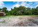 Partially cleared lot with mature trees and a small cabin at 7813 Valrie Ln, Riverview, FL 33569