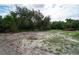 Partially cleared lot with mature trees at 7813 Valrie Ln, Riverview, FL 33569
