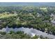 Aerial view of a waterfront property with a large lot at 7813 Valrie Ln, Riverview, FL 33569