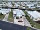 Aerial view of waterfront community with single-story homes, boat access, and manicured lawns at 107 E Saint Johns Way, Apollo Beach, FL 33572