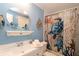Bathroom with tub and nautical theme decor at 107 E Saint Johns Way, Apollo Beach, FL 33572