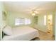 Light and airy bedroom with a queen-size bed at 107 E Saint Johns Way, Apollo Beach, FL 33572
