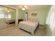 Guest bedroom with a double bed and mirrored closet at 107 E Saint Johns Way, Apollo Beach, FL 33572