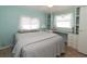 Bedroom with built-in desk and full-size bed at 107 E Saint Johns Way, Apollo Beach, FL 33572