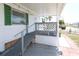 Front porch with ramp for accessibility and decorative railing at 107 E Saint Johns Way, Apollo Beach, FL 33572