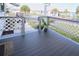 Spacious front porch with a plant and decorative railing at 107 E Saint Johns Way, Apollo Beach, FL 33572