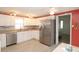 Kitchen with white cabinets, stainless steel appliances, and a breakfast nook at 107 E Saint Johns Way, Apollo Beach, FL 33572