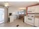 View of a kitchen with white cabinets and stainless steel appliances at 107 E Saint Johns Way, Apollo Beach, FL 33572