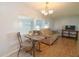 Bright living room with comfy couch and dining area at 107 E Saint Johns Way, Apollo Beach, FL 33572