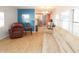 Living room featuring a large beige couch and a brown recliner at 107 E Saint Johns Way, Apollo Beach, FL 33572