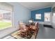 Bright sunroom with table and chairs, ideal for relaxing at 107 E Saint Johns Way, Apollo Beach, FL 33572
