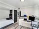 Bedroom with twin bed, desk, and built-in shelving at 4141 Bayshore Blvd # 1203, Tampa, FL 33611