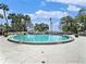 Community pool with a view of the bay at 4141 Bayshore Blvd # 1203, Tampa, FL 33611