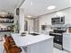 Modern kitchen with white cabinets, quartz countertops, and island at 4141 Bayshore Blvd # 1203, Tampa, FL 33611