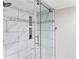 Clean and modern walk-in shower with marble tile at 4141 Bayshore Blvd # 1203, Tampa, FL 33611