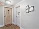 Building hallway with apartment doors and decorative accents at 4141 Bayshore Blvd # 1203, Tampa, FL 33611