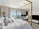 Main bedroom with a canopy bed and a stunning view at 4141 Bayshore Blvd # 1203, Tampa, FL 33611