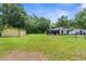 Spacious backyard offering a shed and screened patio at 28541 Lindenhurst Dr, Wesley Chapel, FL 33544