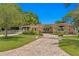 Charming ranch home with paver driveway, mature landscaping, and fenced yard at 401 Appian Ne Way, St Petersburg, FL 33704