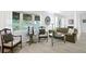 Bright living room featuring comfortable seating and large windows at 401 Appian Ne Way, St Petersburg, FL 33704