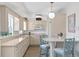 Modern kitchen with light cabinets, quartz countertops, and stainless steel appliances at 401 Appian Ne Way, St Petersburg, FL 33704