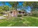 Charming single story home with lush landscaping and a fenced yard at 401 Appian Ne Way, St Petersburg, FL 33704