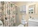 Clean bathroom with shower, toilet, and vanity at 401 Appian Ne Way, St Petersburg, FL 33704