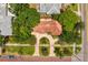 House with circular driveway, surrounded by lush landscaping and trees at 401 Appian Ne Way, St Petersburg, FL 33704