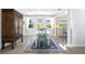 Charming dining area with a white table, blue chairs, and an antique cabinet at 401 Appian Ne Way, St Petersburg, FL 33704