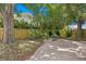 Relaxing brick patio area with a small table and chairs at 401 Appian Ne Way, St Petersburg, FL 33704