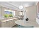 Bright kitchen with light-colored cabinets and a breakfast bar at 401 Appian Ne Way, St Petersburg, FL 33704