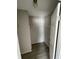 Walk-in closet with double hanging rods and wood-look floors at 8353 Normandy Dr, Weeki Wachee, FL 34613