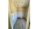 Laundry room with wood-look floors and shelving for storage at 8353 Normandy Dr, Weeki Wachee, FL 34613