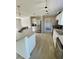 Modern kitchen with island, stainless steel appliances, and white cabinets at 8353 Normandy Dr, Weeki Wachee, FL 34613