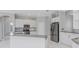 Modern kitchen with stainless steel appliances and white cabinets at 6218 Bridleford Dr, Wesley Chapel, FL 33545