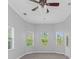 Bright bedroom with multiple windows and a ceiling fan at 6218 Bridleford Dr, Wesley Chapel, FL 33545