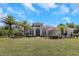 Two story house with double doors and lush landscaping at 6218 Bridleford Dr, Wesley Chapel, FL 33545