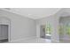 Open living area with marble floors and access to a screened lanai at 6218 Bridleford Dr, Wesley Chapel, FL 33545