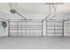 Spacious two-car garage with storage shelves at 6218 Bridleford Dr, Wesley Chapel, FL 33545