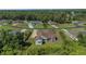 Aerial view of house, large backyard, and neighborhood at 6218 Bridleford Dr, Wesley Chapel, FL 33545