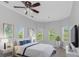 Spacious bedroom with large windows and TV at 6218 Bridleford Dr, Wesley Chapel, FL 33545
