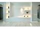 Bright living room with built-in shelving and marble flooring at 6218 Bridleford Dr, Wesley Chapel, FL 33545