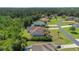 Aerial view of house and neighborhood, showing property lines and landscaping at 6218 Bridleford Dr, Wesley Chapel, FL 33545