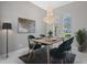 Formal dining room with chandelier and seating for four at 6218 Bridleford Dr, Wesley Chapel, FL 33545