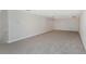 Spacious bonus room with grey carpet at 6218 Bridleford Dr, Wesley Chapel, FL 33545