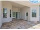 Spacious covered patio with tile flooring, sliding glass doors, and ceiling fan at 6218 Bridleford Dr, Wesley Chapel, FL 33545